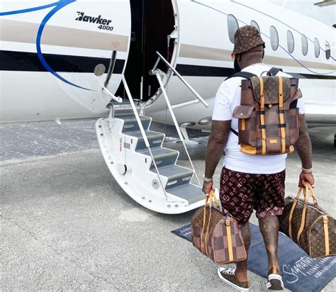 rick ross spotted with fake louis vuitton|rick ross net worth $100 million.